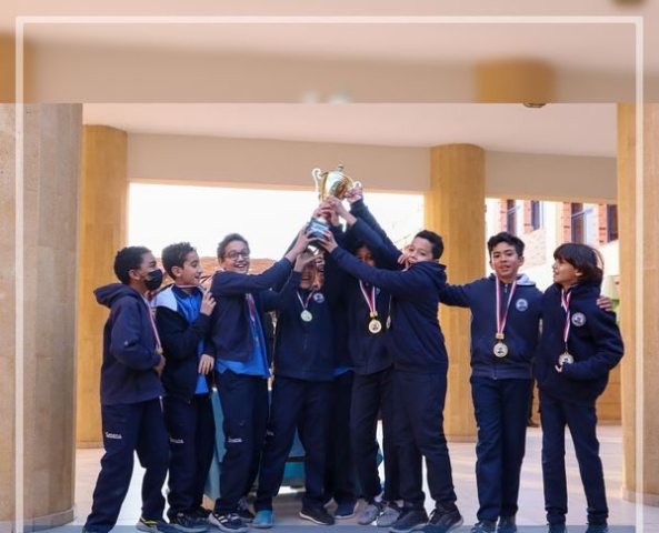 I.S.K American Division Students receiving the cup for football tournament!