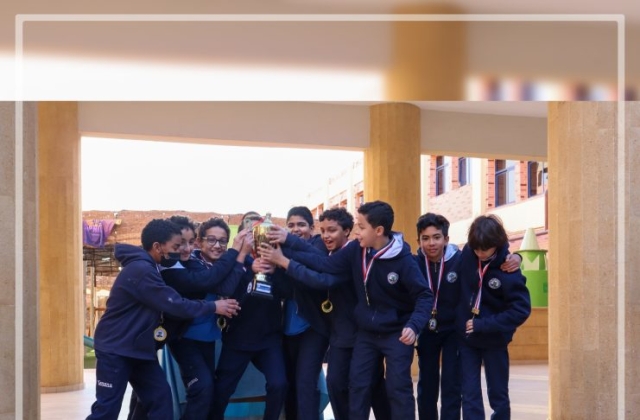 I.S.K American Division Students receiving the cup for football tournament!