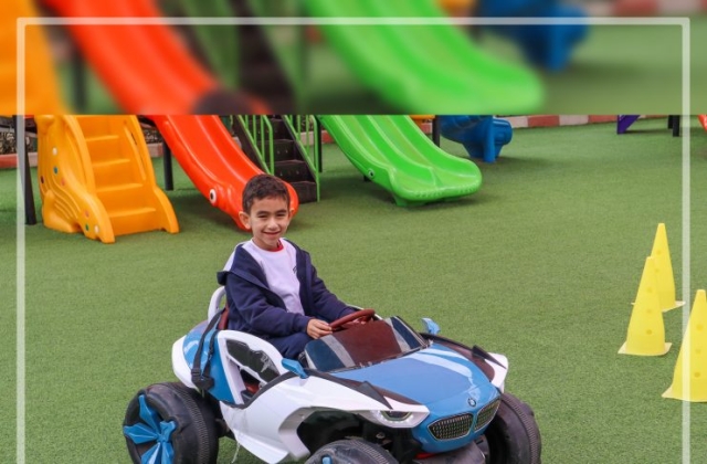 I.S.K | American Division | "Students having fun riding the cars" KG 1B | 2022-2023