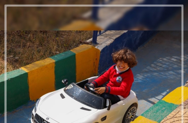 I.S.K | American Division | "Students having fun riding the cars" KG 1B | 2022-2023