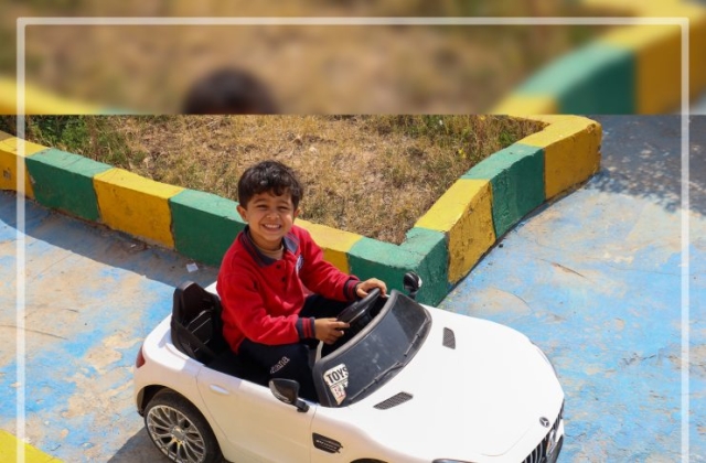 I.S.K | American Division | "Students having fun riding the cars" KG 1B | 2022-2023