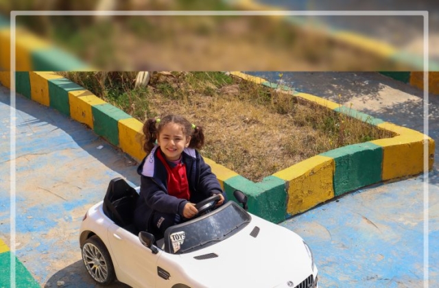 I.S.K | American Division | "Students having fun riding the cars" KG 1B | 2022-2023