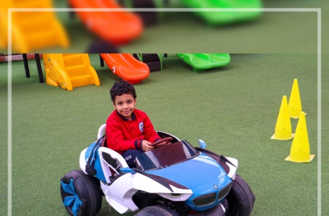 I.S.K | American Division | "Students having fun riding the cars" KG 1B | 2022-2023