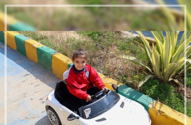 I.S.K | American Division | "Students having fun riding the cars" KG 1B | 2022-2023